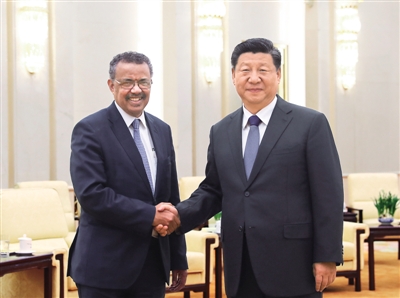 习近平会见世界卫生组织总干事谭德塞