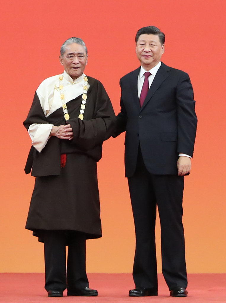 热地同志生平
